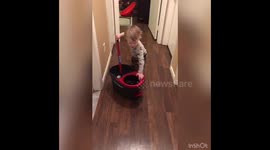 Toddler Mopping Floor