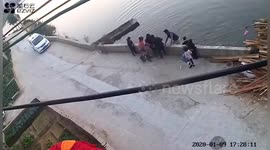 Chinese villagers rescue child from drowning in river after he accidentally fell in