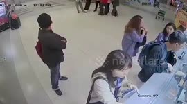 Thief steals passenger's purse the moment it's accidentally dropped in airport queue