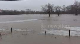 Ontario flash flooding of farm fields at Nith River spills it's banks after winter rain storm in Wellesley township near New Hamburg