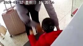 Hurried Chinese father accidentally puts his son onto security scanner conveyor belt at train station