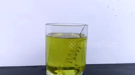 This copper coil has an amazing corrosive reaction to Nitric acid
