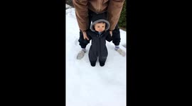 Dad fail! Cute clip shows baby FACEPLANT in the snow