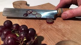 Incredibly sharp knife slices grape with super-satisfying ease