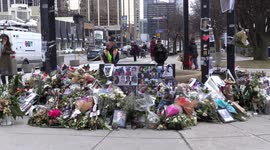 Huge memorial in Toronto Canada for Iranian victims of flight PS752 crash with flowers, candles and photographs of the many Canadian victims many of whom were university and high school students.