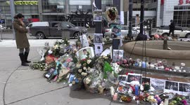 Flowers, candles and photographs at memorial in Toronto for victims of downed Ukrainian plane