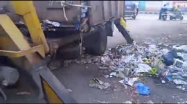 Indian sanitation workers pick up allegedly drunk man along with the garbage