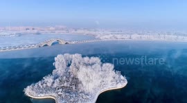 Stunning drone footage showcases incredible 'frost flowers' on frozen lake in northwestern China