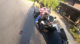 Mother riding motorcycle with son crashes into biker in Thailand