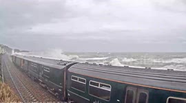 Moment Great Western Railway train makes emergency stop for injured passengers after windows smashed by Dawlish waves