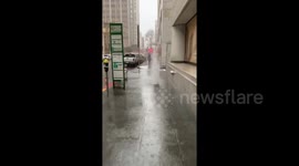 Water burst from the ground during heavy rain in San Francisco