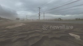 Taal Volcano Crisis - Vehicles Travel On Roads Covered In Thick Volcanic Ash