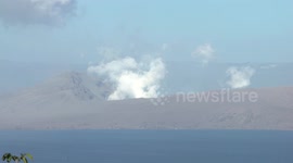 Steam is seen rising from the crater of the recently erupted Taal volcano