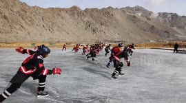 Locals take part in ice hockey match on natural ice rink in northern India