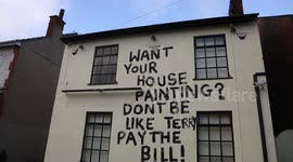 Disgruntled painter takes revenge by daubing a message on an old pub