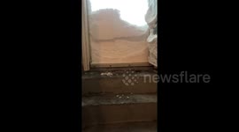 Crazy moment snowstorm blocks doorway in St. John, Canada