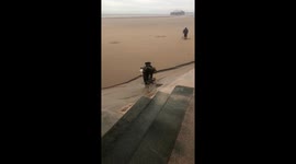Metal detectors looking for treasures on Blackpool beach