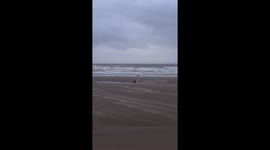 Very very windy on Blackpool beach and the sand blowing onto the promenade.