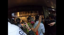 Riot police and protesters argue as clearance of statue square proceeds.