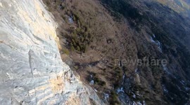 French daredevil wingsuits through dense forest in the French Alps