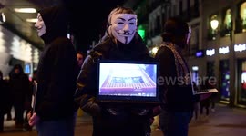 'Anonymous' protesters use laptops to demonstrate against animal cruelty