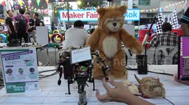 Artificial Intelligence Teddy Bear controlled by robot on display at Thai tech convention
