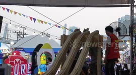Children Send Handmade Cars Down Wooden Slide