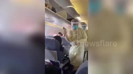 Medics on Air China plane check passengers' temperatures in bid to contain new virus