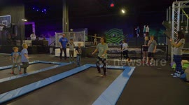 Boy does backflips and twists, in Slow motion, on a trampoline