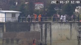 Chinese police officers jump into freezing river to rescue drowning elderly woman