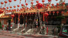 Decorations go up as staff prepare Indonesian temple for Chinese New Year celebrations