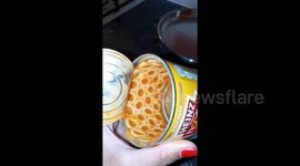 Spaghetti hoops lined up perfectly inside of tin can and it's inexplicably satisfying