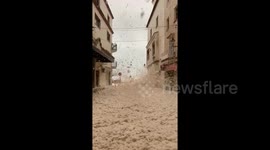 Seaside town filled with foam as deadly storm Gloria batters eastern Spain