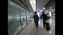 Temperature checks carried out on children at Hong Kong Airport