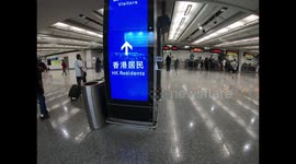 Automatic dispensers offer disinfecting gel for travelers at Hong Kong airport