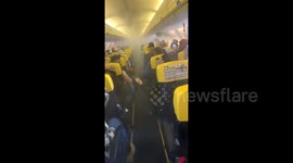 Horrific moment smoke fills cabin on Ryanair flight from Romania to London