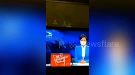 Chinese TV presenter wears mask during broadcast to encourage people to cover their faces amid coronavirus outbreak