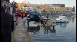 Car hanging on the edge after the crush