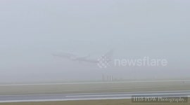 Now you see them ... Planes take off from Manchester in thick fog
