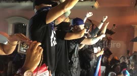 Hundreds join anti-government protest organised by Puerto Rican rapper Rene Perez
