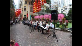 Chinese orchestra plays Pipa (Chinese lute) for Chinese New Year in Wanchai, Hong Kong