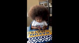 Baby talks on cell phone