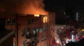 Historic New York City Chinatown building caught on fire while FDNY rescues a trapped resident