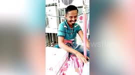 Ice cream seller has wacky moustache in the Philippines