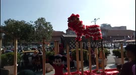 This Lion dance is paired with a mickey mouse