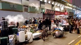 Hong Kong Lunar New Year annual street food market. Vendors sell their street food to customers