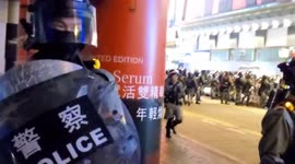 Hong Kong riot police threaten journalists after storming a traditional lunar new year street food market