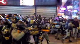 Hong Kong riot police fire pepper rounds at bystanders next to last remaining new year market