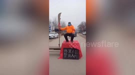 Chinese villagers hold sword and toy gun to stop outsiders from entering their towns due to coronavirus outbreak