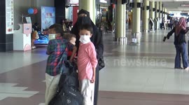 prospective aircraft passengers and international airport security officers wear masks in anticipation of the spread of the corona virus